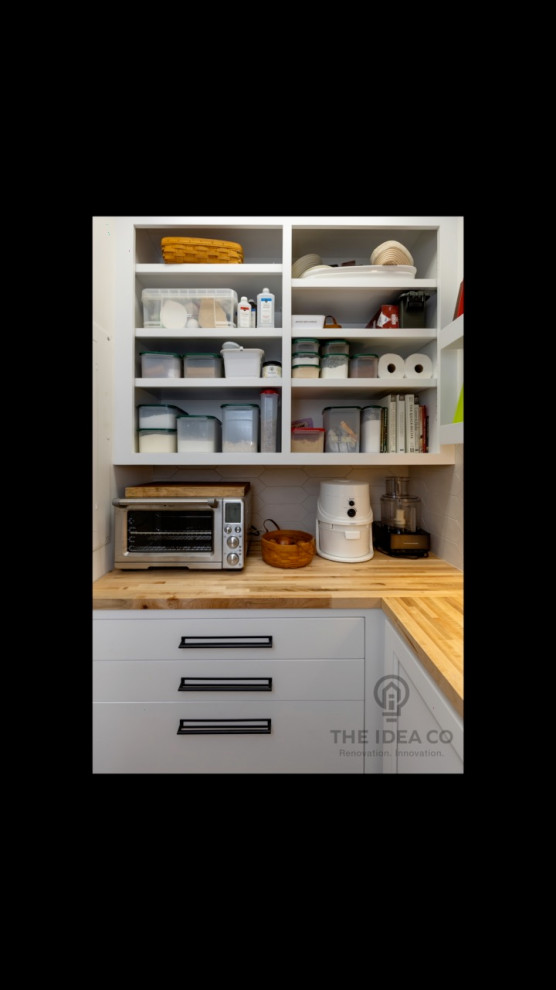 Mid-sized transitional galley light wood floor and brown floor kitchen pantry photo with a single-bowl sink, recessed-panel cabinets, white cabinets, quartzite countertops, multicolored backsplash, ceramic backsplash, stainless steel appliances, an island and white countertops