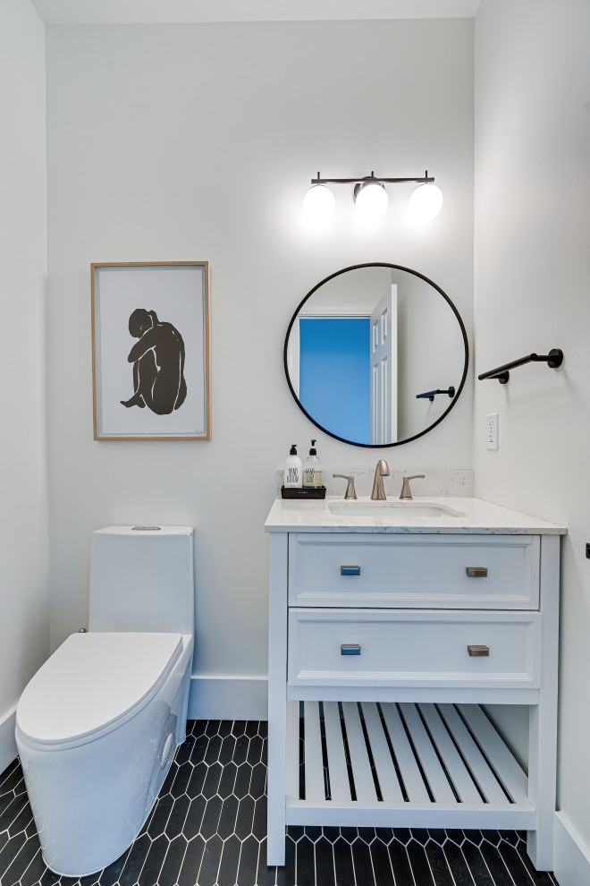 Photo of a small modern bathroom in DC Metro with a one-piece toilet, white walls, ceramic floors, black floor, white benchtops, a single vanity and a freestanding vanity.