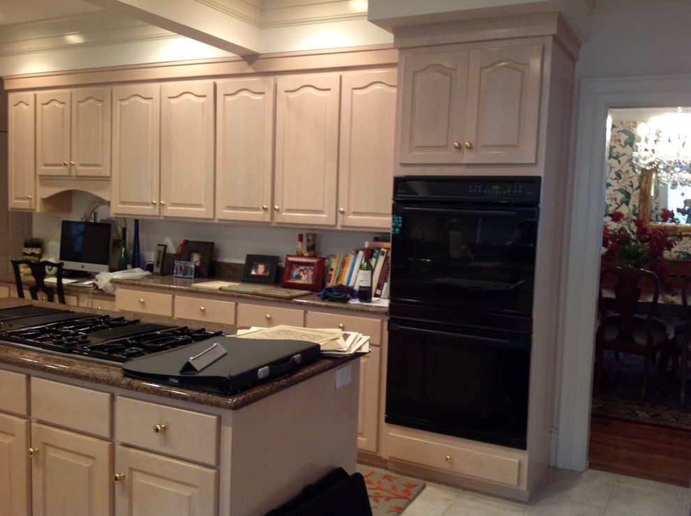 Large transitional open concept kitchen photo with raised-panel cabinets, light wood cabinets, granite countertops and an island
