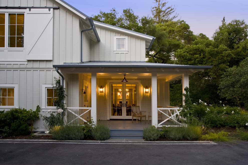 Photo of a country front yard verandah in San Francisco with a roof extension.