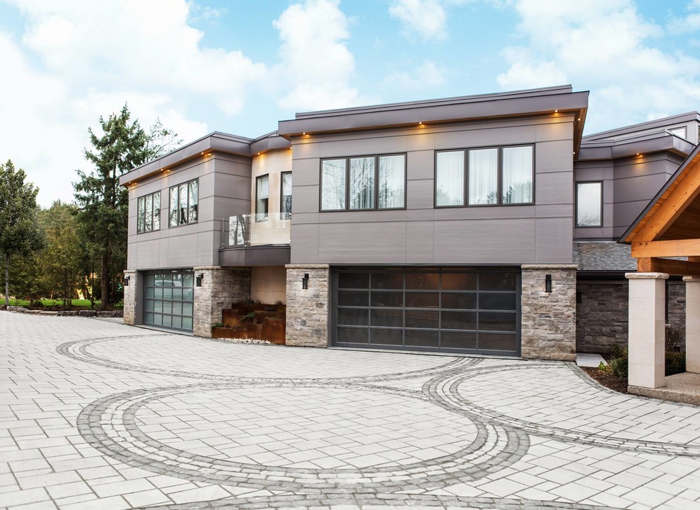 Photo of an expansive contemporary attached four-car garage in Philadelphia.
