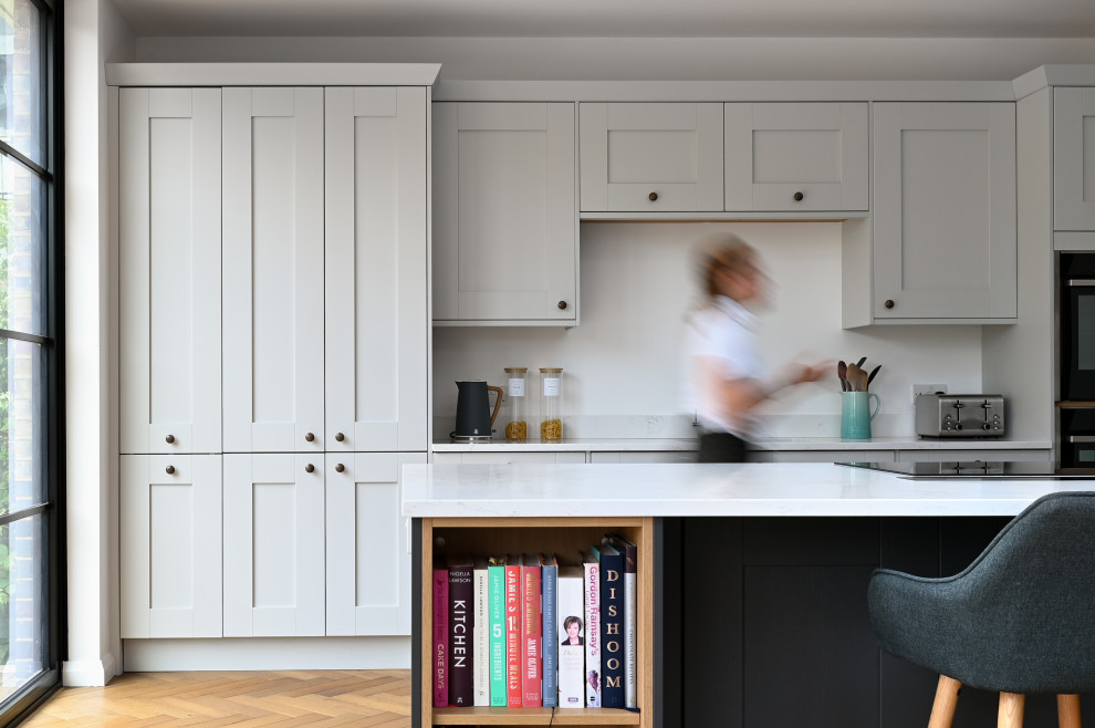 Design ideas for a large transitional kitchen in London.
