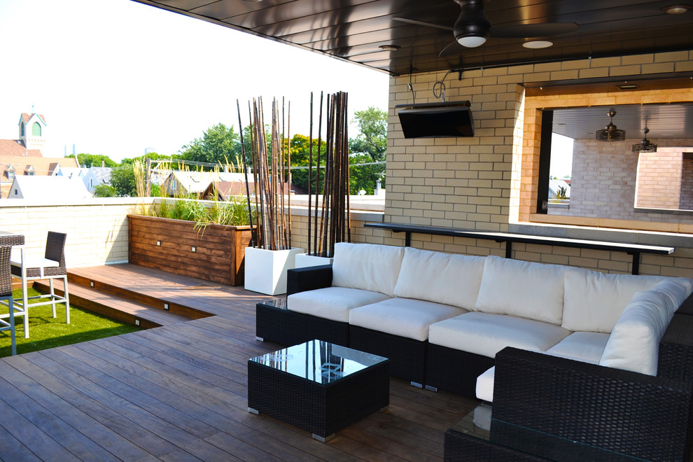 Mid-sized trendy rooftop deck photo in Chicago with a fire pit and a roof extension