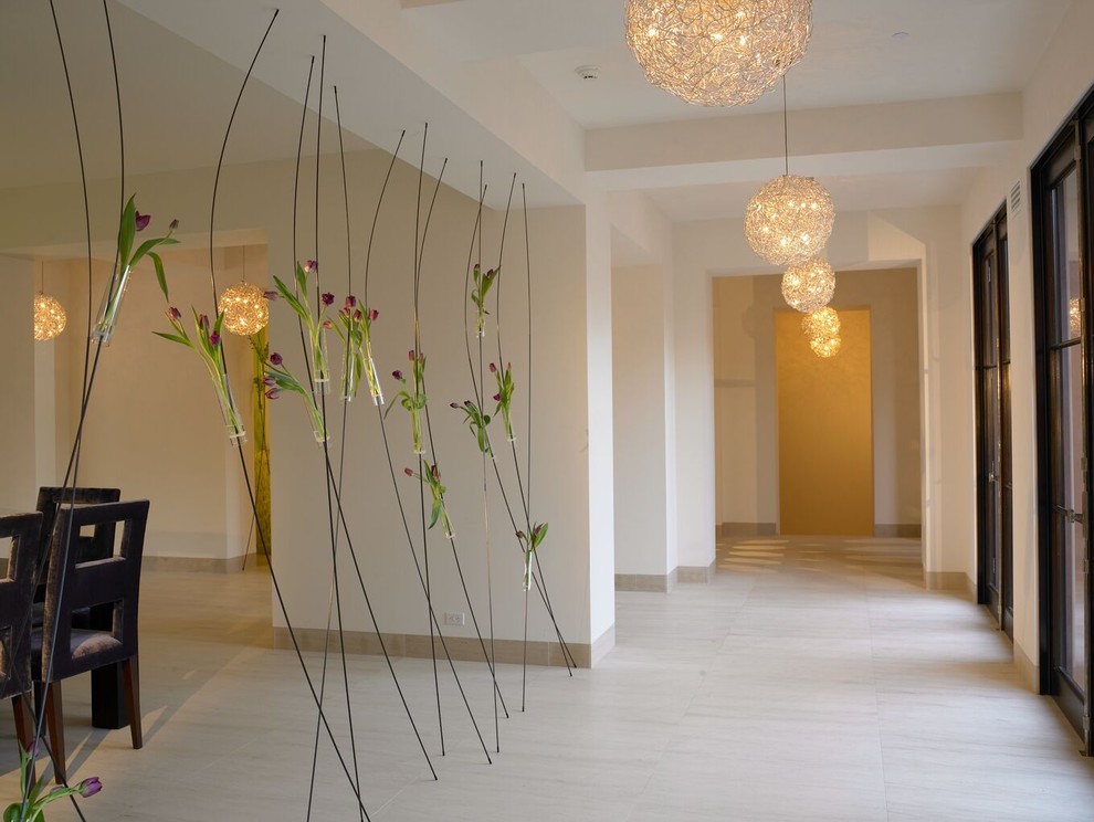 Design ideas for a mediterranean hallway in San Diego with white walls.