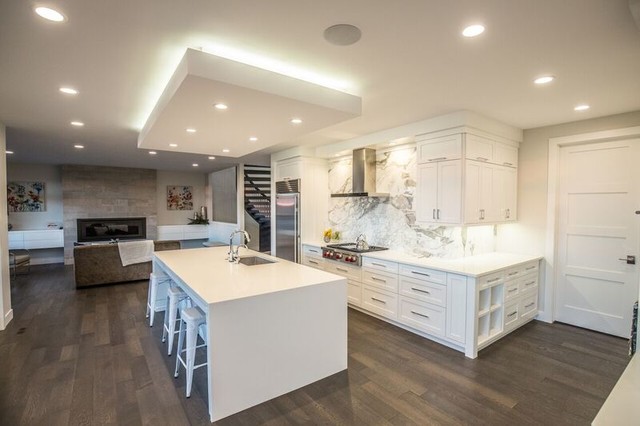 White Quartz With Waterfall Edge And Calacatta Backsplash
