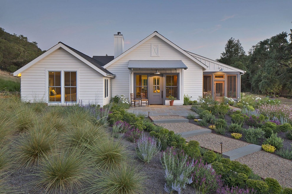 Country one-storey white house exterior in San Francisco with a gable roof.