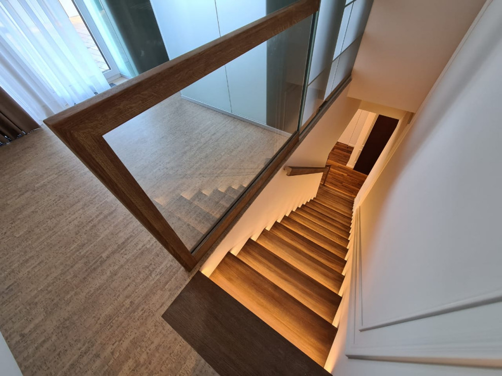 Design ideas for a mid-sized contemporary wood straight staircase in Other with wood risers and glass railing.