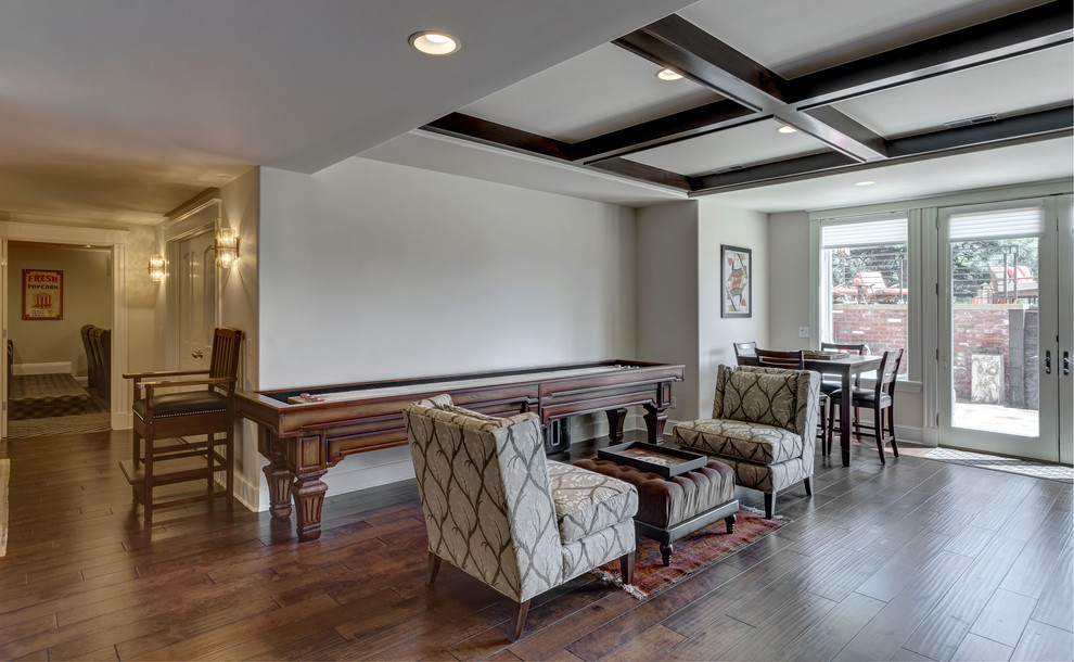 Inspiration for a large transitional walk-out dark wood floor and brown floor basement remodel in Denver with gray walls and no fireplace