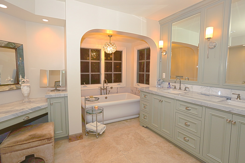 Inspiration for an expansive midcentury master bathroom in Orange County with recessed-panel cabinets, green cabinets, a freestanding tub, white tile, marble, quartzite benchtops, white benchtops, a double vanity, a built-in vanity, an alcove shower, a one-piece toilet, yellow walls, ceramic floors, a console sink, beige floor, a hinged shower door and a shower seat.