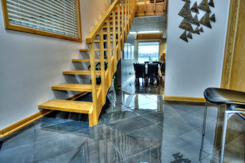 Design ideas for a mid-sized transitional wood straight staircase in Other with open risers.