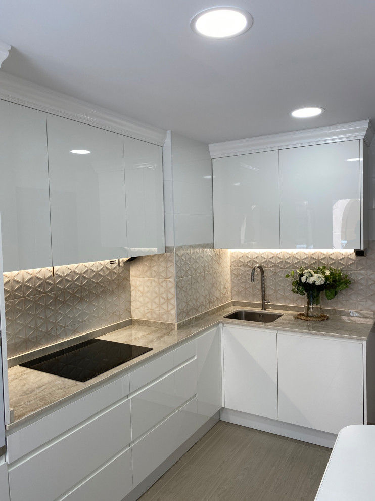 Enclosed kitchen - mid-sized transitional l-shaped porcelain tile and beige floor enclosed kitchen idea in Other with an integrated sink, recessed-panel cabinets, white cabinets, marble countertops, white backsplash, quartz backsplash, white appliances and beige countertops