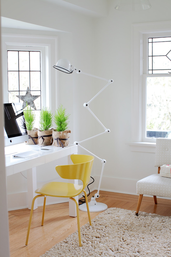 Inspiration for an eclectic home office in Vancouver with a freestanding desk.
