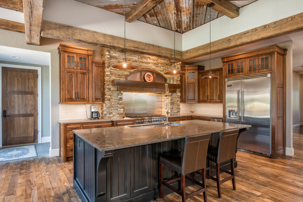 Inspiration for a large rustic l-shaped open concept kitchen remodel with raised-panel cabinets, medium tone wood cabinets and an island