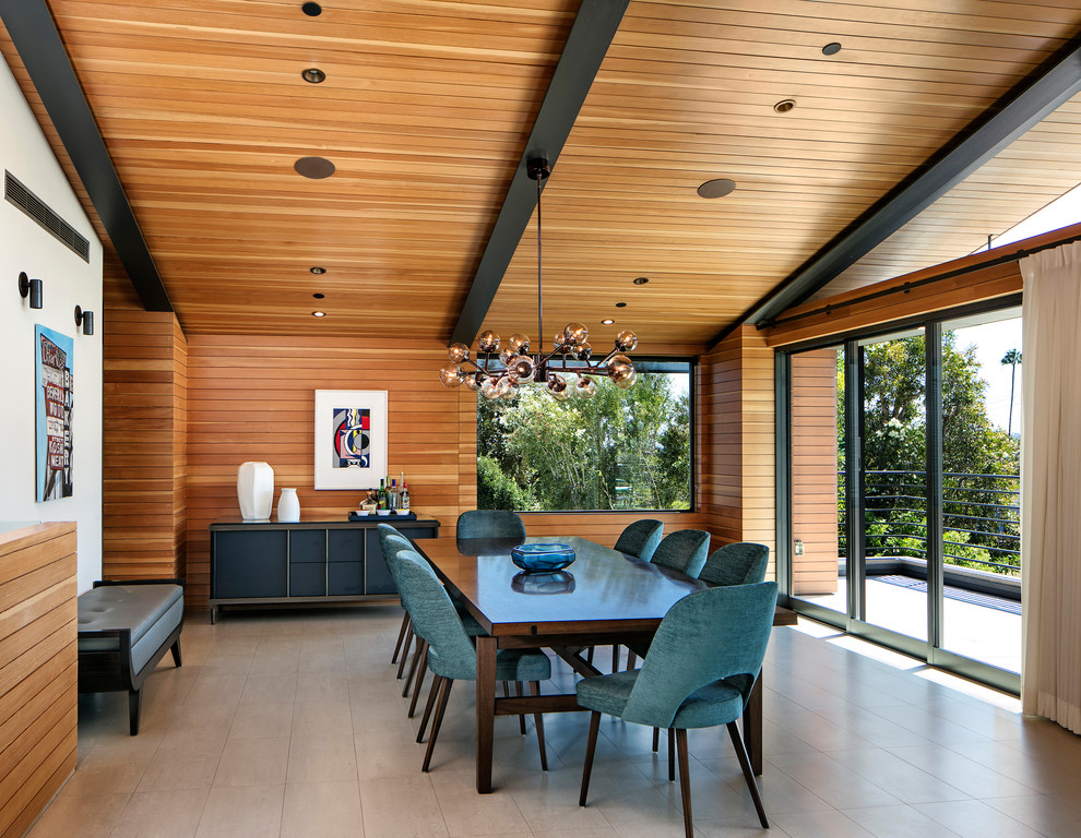 Inspiration for a large midcentury dining room in Los Angeles with porcelain floors and beige floor.