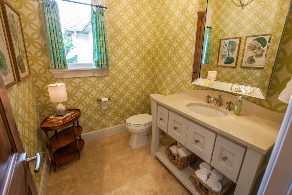 Design ideas for a mid-sized transitional powder room in Oklahoma City with open cabinets, white cabinets, a two-piece toilet, beige tile, ceramic tile, multi-coloured walls, ceramic floors, an undermount sink, engineered quartz benchtops and beige benchtops.