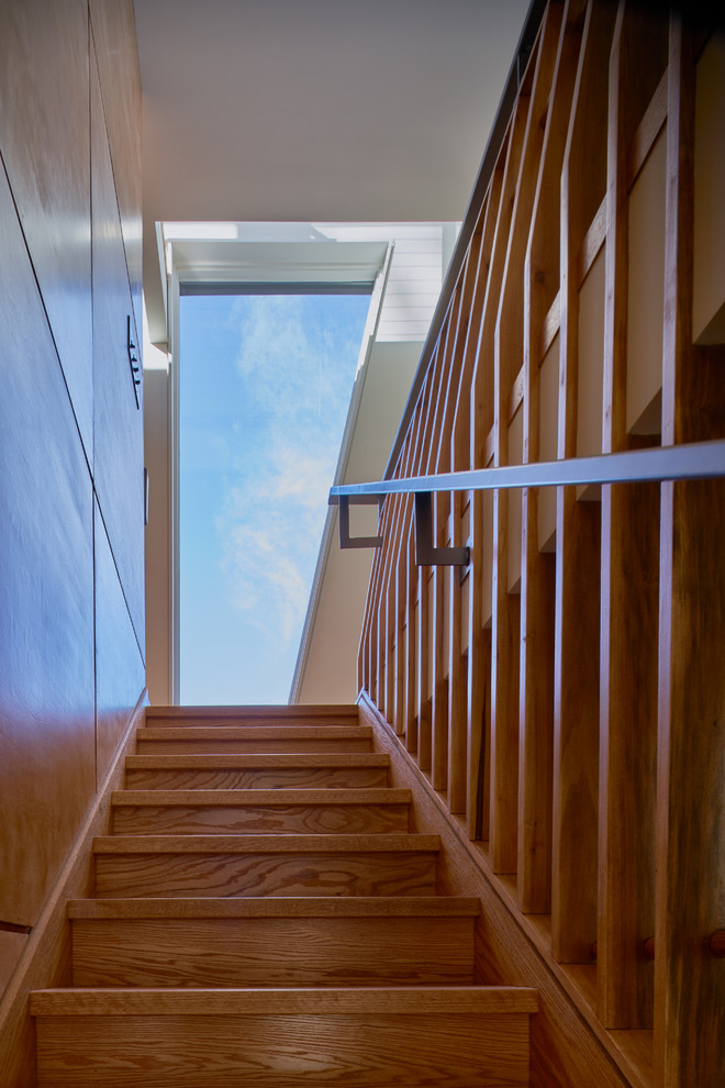 Inspiration for a mid-sized modern wood straight staircase in Other with wood risers and wood railing.