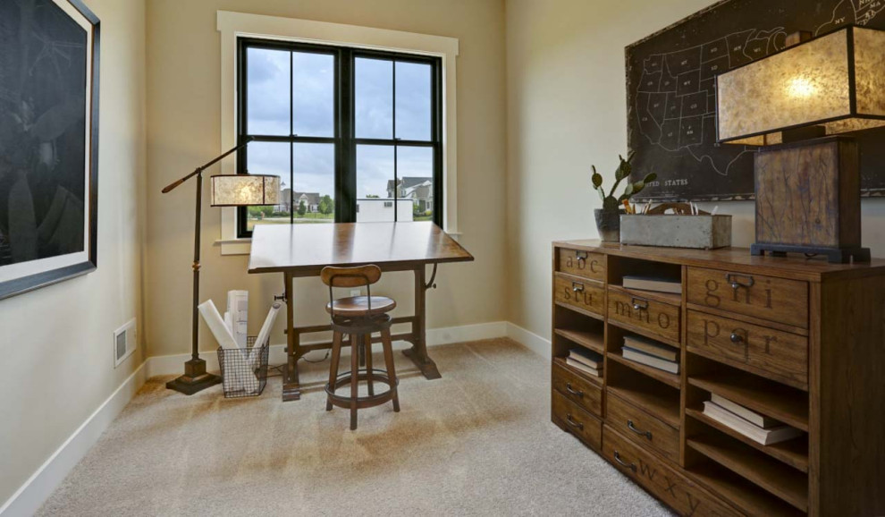 Photo of a large arts and crafts study room in Other with beige walls, carpet, a freestanding desk and beige floor.