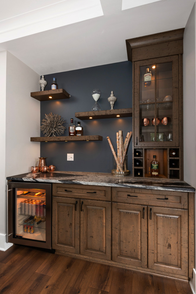 Inspiration for a classic home bar in Other with a feature wall.