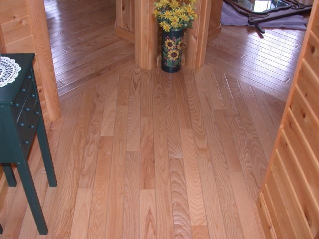 Hallway - transitional light wood floor hallway idea