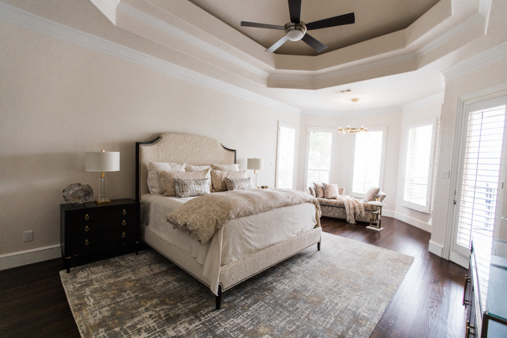 Inspiration for a large transitional master bedroom in Dallas with beige walls, dark hardwood floors, brown floor and recessed.