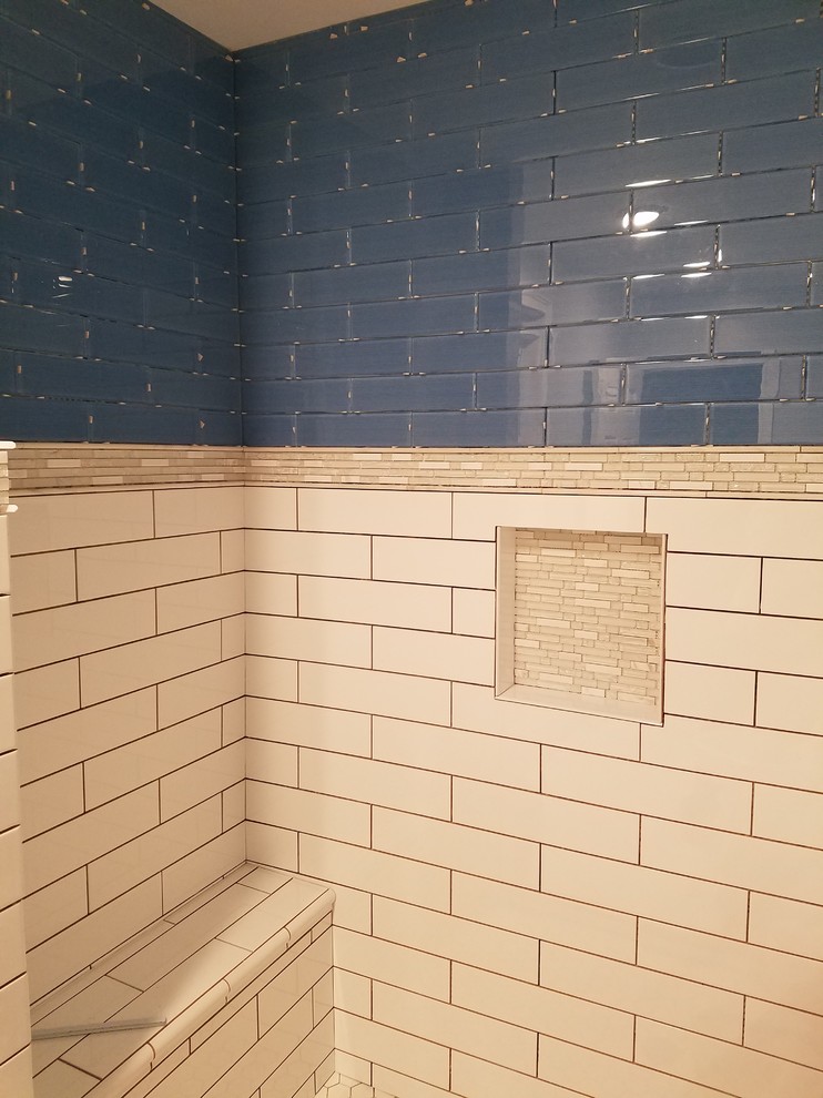 Example of a small transitional 3/4 blue tile and glass tile porcelain tile alcove shower design in Cincinnati with recessed-panel cabinets, black cabinets, a two-piece toilet, gray walls, an undermount sink and quartz countertops