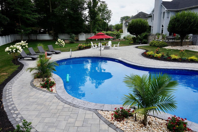 Manalapan, NJ: Freeform Paver Patio with Pool installation & Firepit contemporary-garden