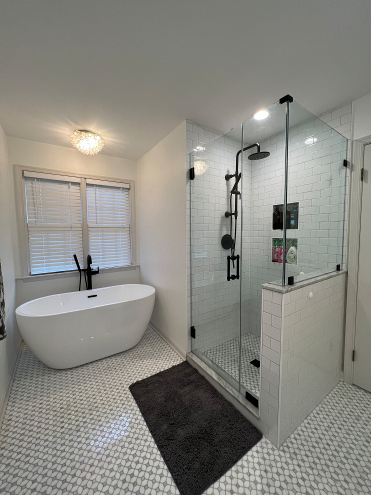 Mid-sized transitional master white tile and porcelain tile double-sink freestanding bathtub photo in Baltimore with furniture-like cabinets, light wood cabinets, marble countertops, a hinged shower door, white countertops and a freestanding vanity