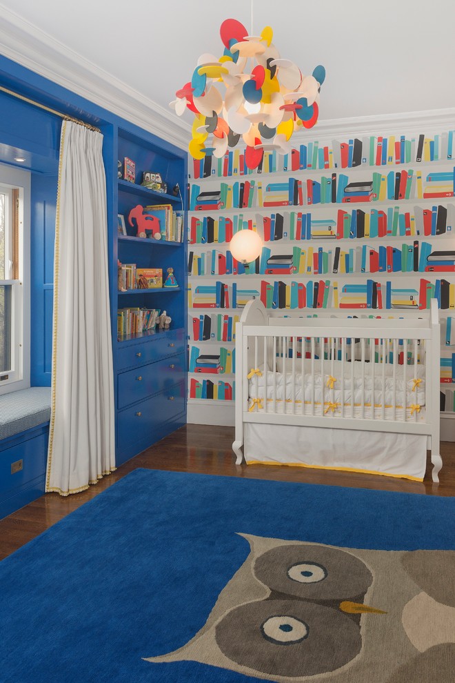Photo of an eclectic gender-neutral nursery in Boston with multi-coloured walls, medium hardwood floors and blue floor.