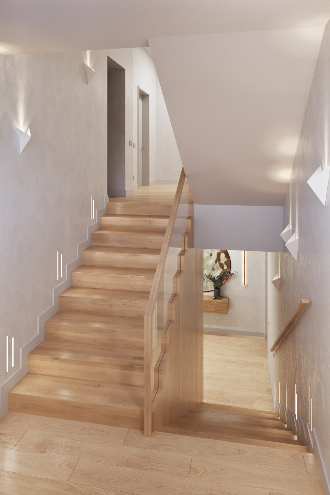 Пример оригинального дизайна: большая п-образная деревянная лестница в современном стиле с деревянными ступенями, перилами из смешанных материалов и панелями на части стены
