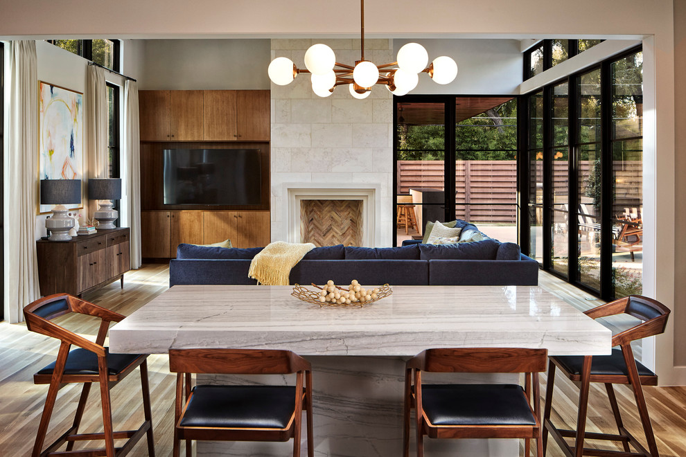 Design ideas for a midcentury open plan dining in Dallas with white walls and medium hardwood floors.