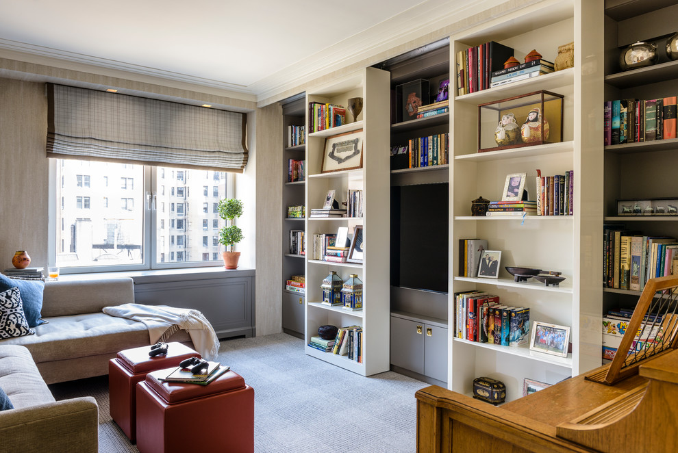 This is an example of a mid-sized transitional enclosed family room in New York with a library, grey walls, carpet, no fireplace and a built-in media wall.