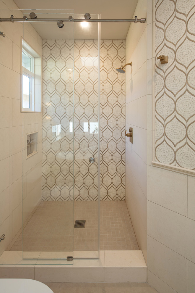 Photo of a large transitional master bathroom in San Luis Obispo with shaker cabinets, grey cabinets, a japanese tub, an alcove shower, beige tile, multi-coloured tile, white tile, beige walls, travertine floors, an undermount sink, marble benchtops, beige floor, a sliding shower screen and grey benchtops.