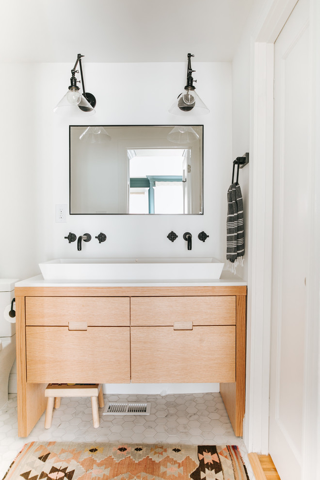 This is an example of a small contemporary kids bathroom in Other with flat-panel cabinets, light wood cabinets, a two-piece toilet, gray tile, porcelain tile, white walls, marble floors, a vessel sink, quartzite benchtops, white benchtops and white floor.