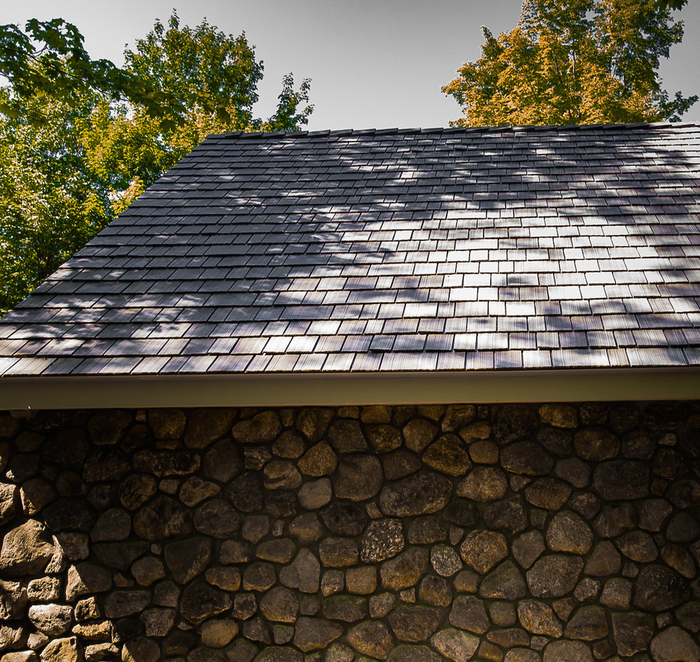 Inspiration for a mid-sized rustic detached three-car carport remodel in Manchester