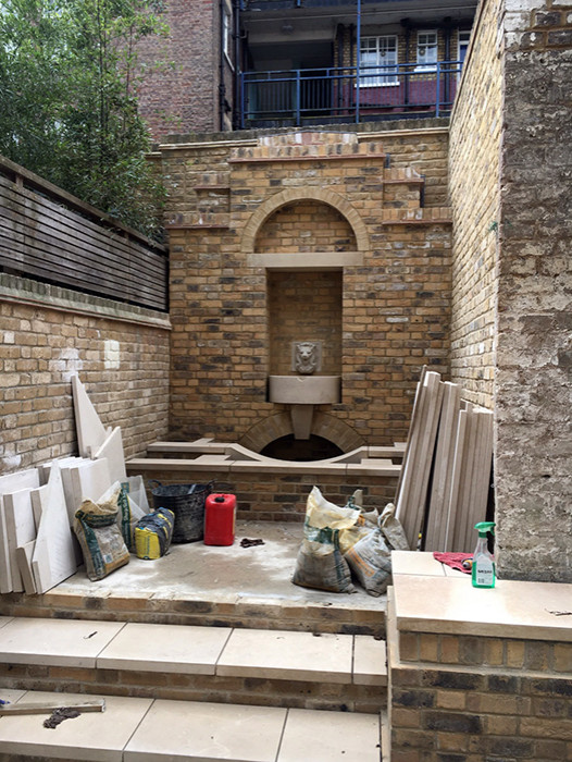 Inspiration for a mid-sized traditional patio in London.
