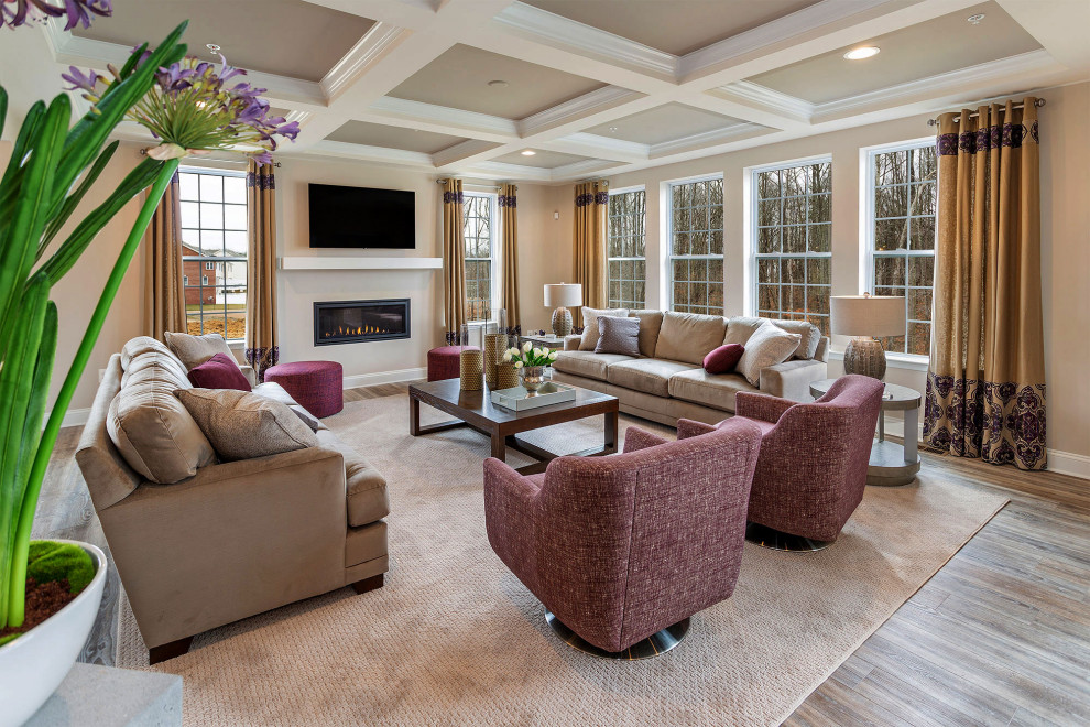 Design ideas for a transitional enclosed living room in DC Metro with beige walls, medium hardwood floors, a ribbon fireplace, a wall-mounted tv, brown floor and coffered.
