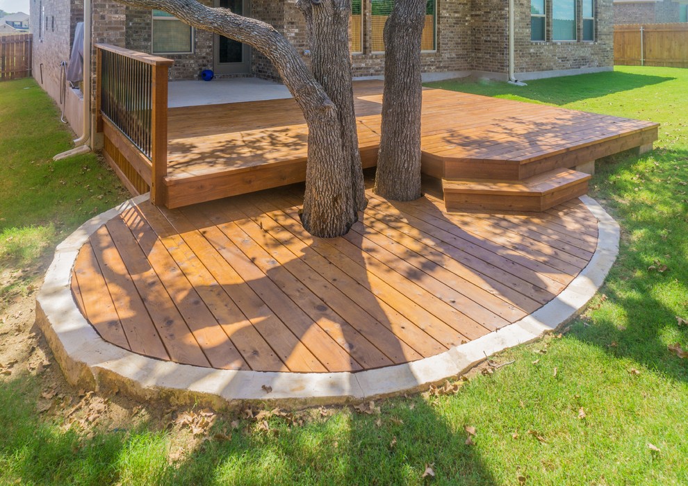 Example of a mid-sized transitional backyard home design design in Austin with a roof extension