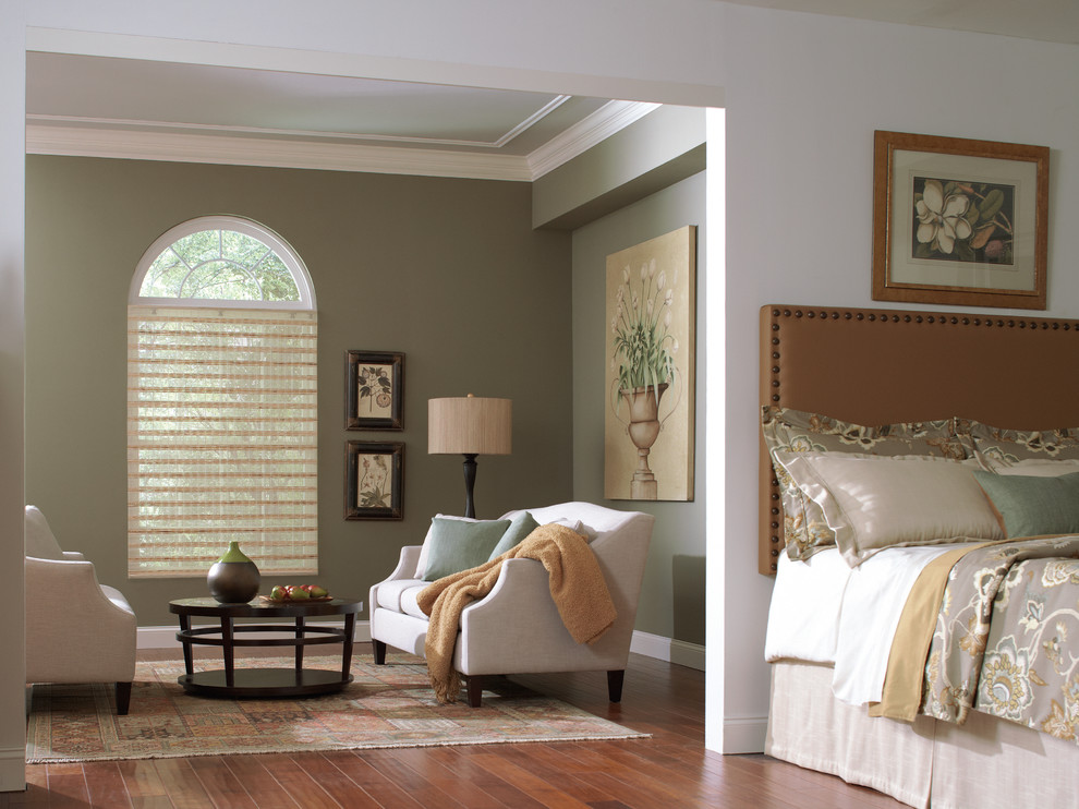 Example of a transitional dark wood floor and brown floor bedroom design