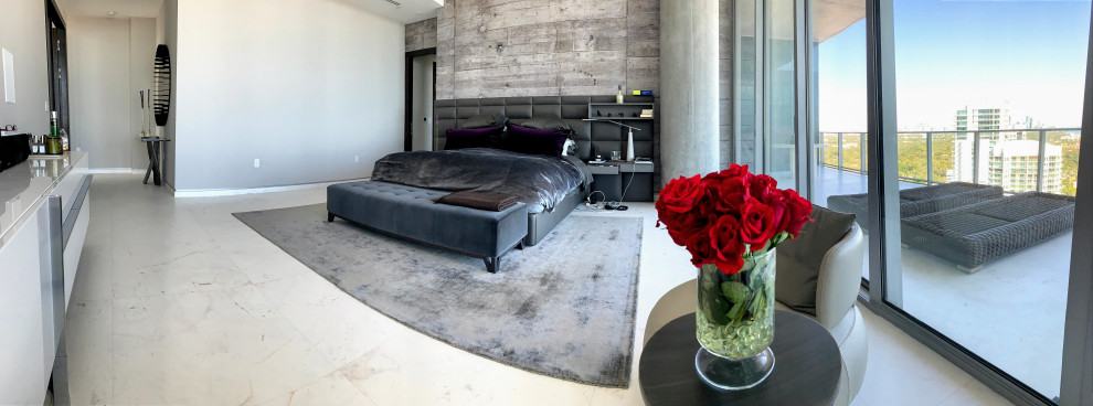 This is an example of a large contemporary master bedroom in Miami with grey walls, marble floors and white floor.