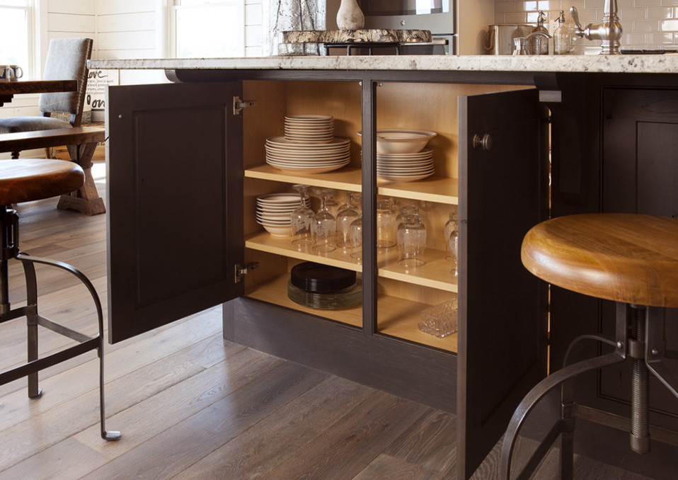 L-shaped kitchen photo with stainless steel appliances and an island