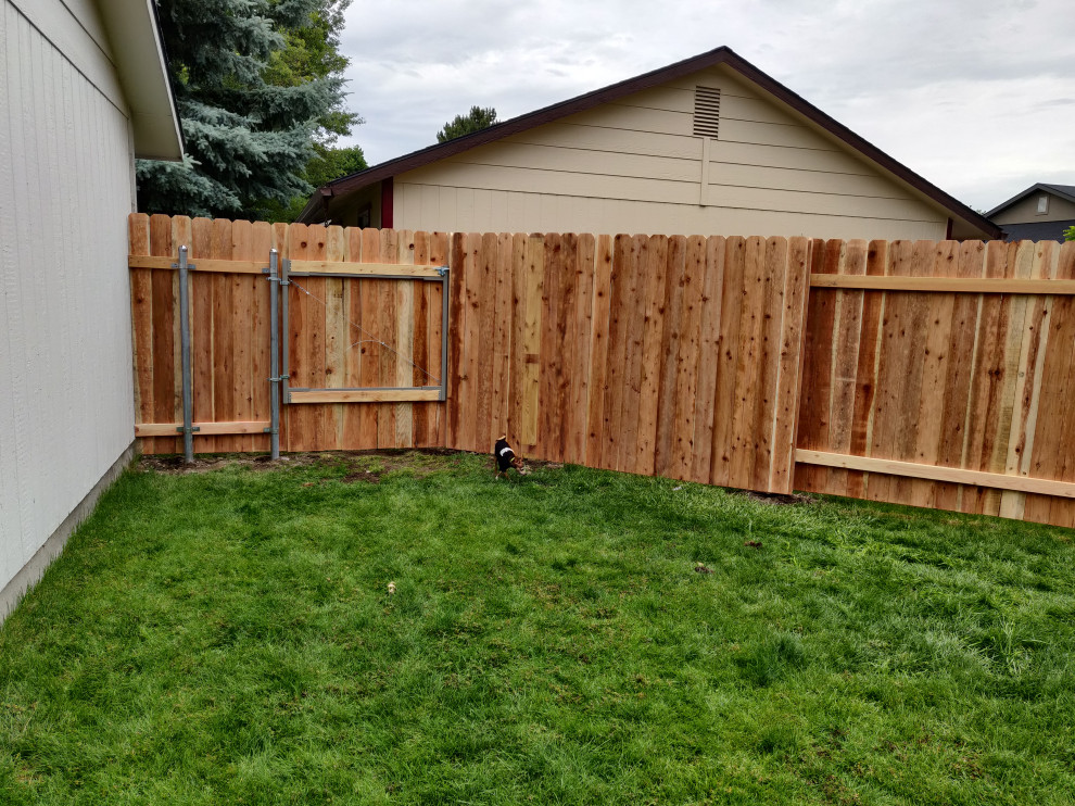 Inspiration for a traditional garden in Boise with with privacy feature and a wood fence.