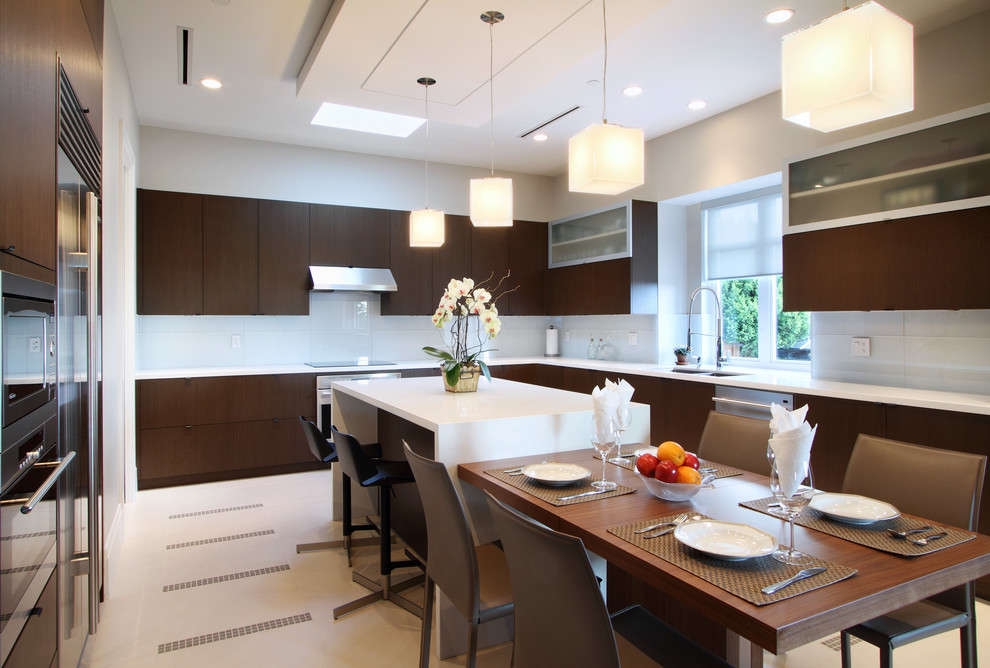 Design ideas for a modern l-shaped open plan kitchen in Vancouver with a double-bowl sink, flat-panel cabinets, dark wood cabinets, marble benchtops, grey splashback, porcelain splashback, stainless steel appliances, ceramic floors and multiple islands.