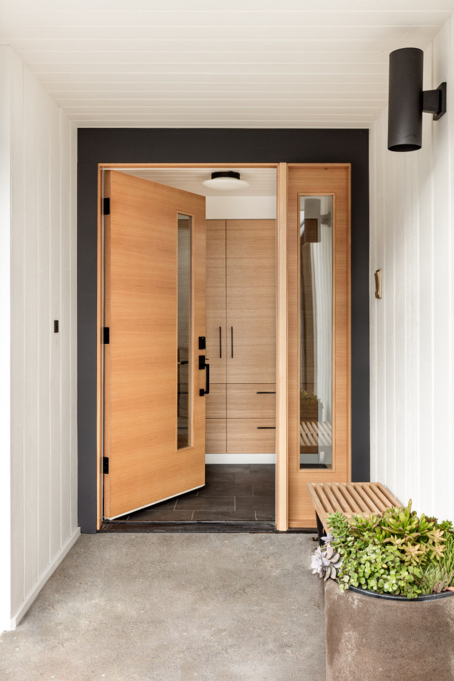 Design ideas for a large midcentury entryway in Seattle.