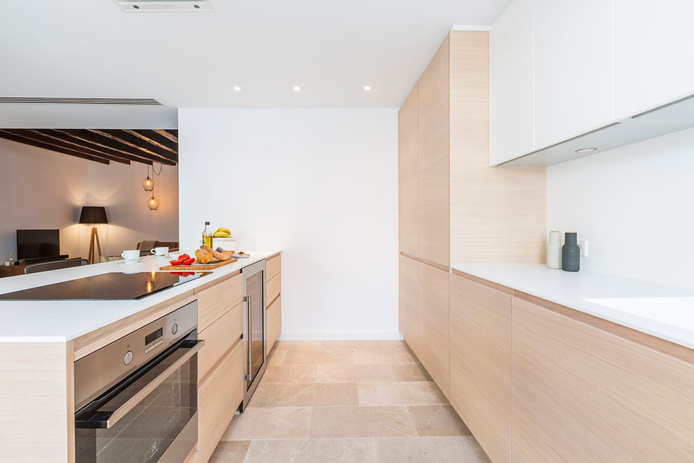 Mid-sized contemporary galley eat-in kitchen in Other with flat-panel cabinets, light wood cabinets, white splashback, stainless steel appliances and no island.