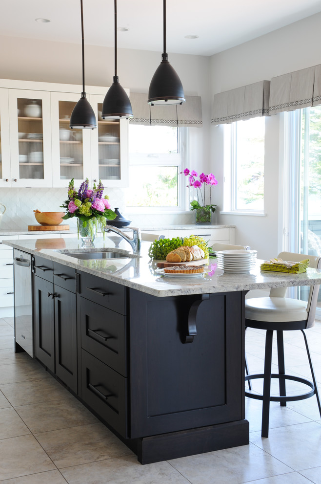 Inspiration for a large beach style l-shaped eat-in kitchen in Vancouver with shaker cabinets, with island, an undermount sink, white cabinets, granite benchtops, white splashback, glass tile splashback, stainless steel appliances and porcelain floors.