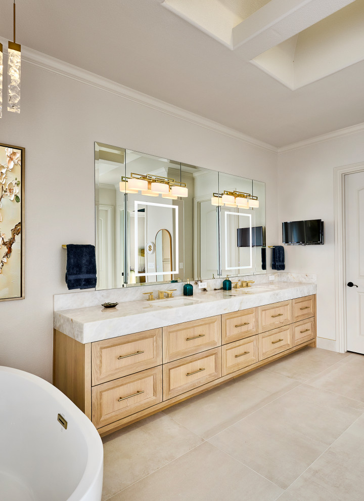 Freestanding bathtub - large transitional master porcelain tile, beige floor and double-sink freestanding bathtub idea in Dallas with recessed-panel cabinets, light wood cabinets, an undermount sink, marble countertops, white countertops and a built-in vanity