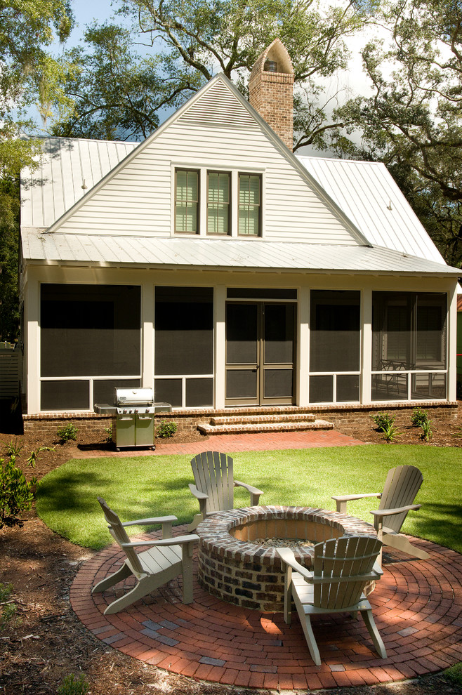 Inspiration for a country two-storey green exterior in Atlanta with wood siding.