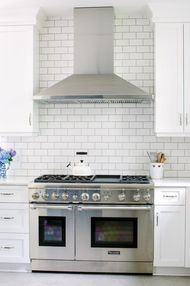 Design ideas for a transitional kitchen in Raleigh with white splashback.