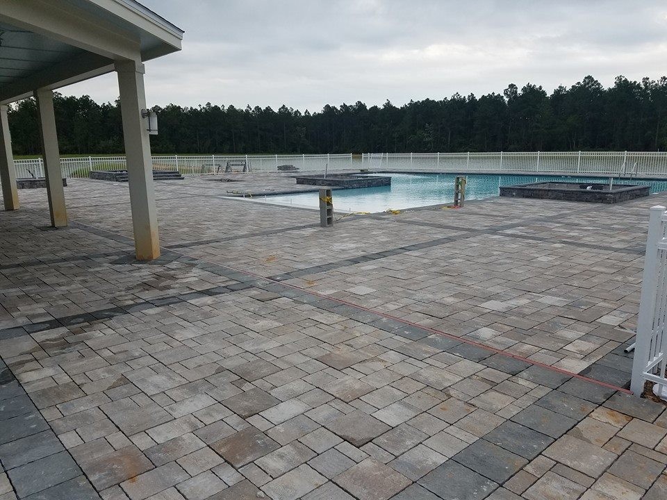 Hot tub - large transitional backyard stone and custom-shaped natural hot tub idea in Miami