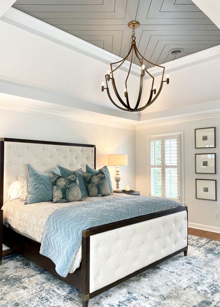 Large transitional master medium tone wood floor, brown floor and shiplap ceiling bedroom photo in Other with white walls